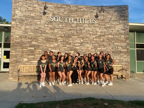 The 2022-2023 South Hills Dance Team poses in front of South Hills High School after attending a dance camp over the summer. 
