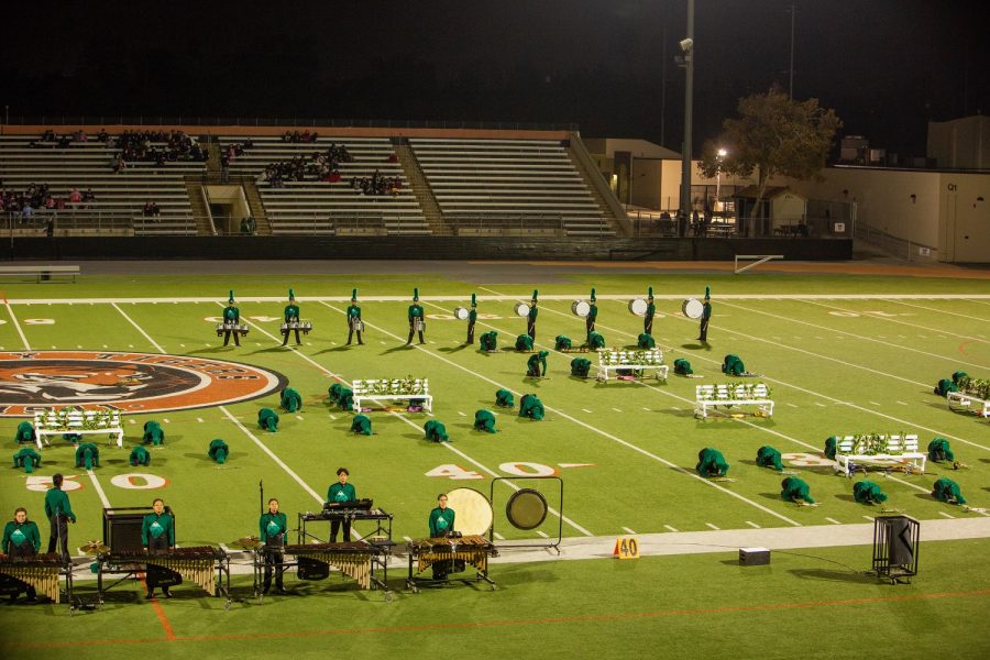 On Saturday October 8, the South Hills marching band and color guard take their positions on the Downey High field as they prepare to start their performance.