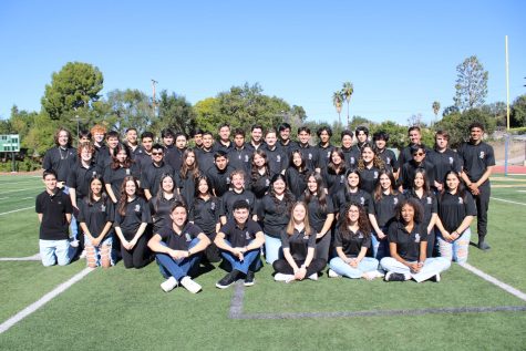 Virtual Enterprise students pose for a photo on the SHHS football field.
