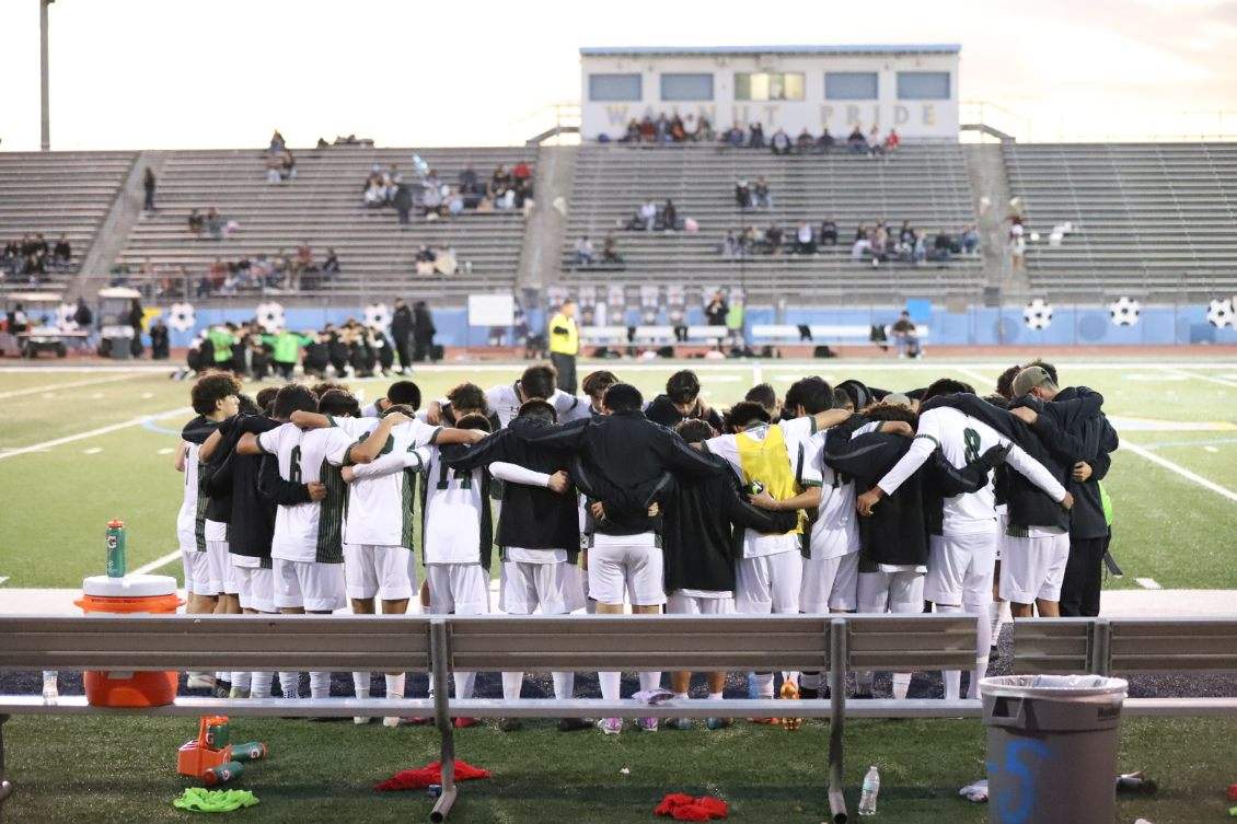 The+South+Hills+boys+varsity+soccer+team+prays+before+their+game+against+Walnut.+