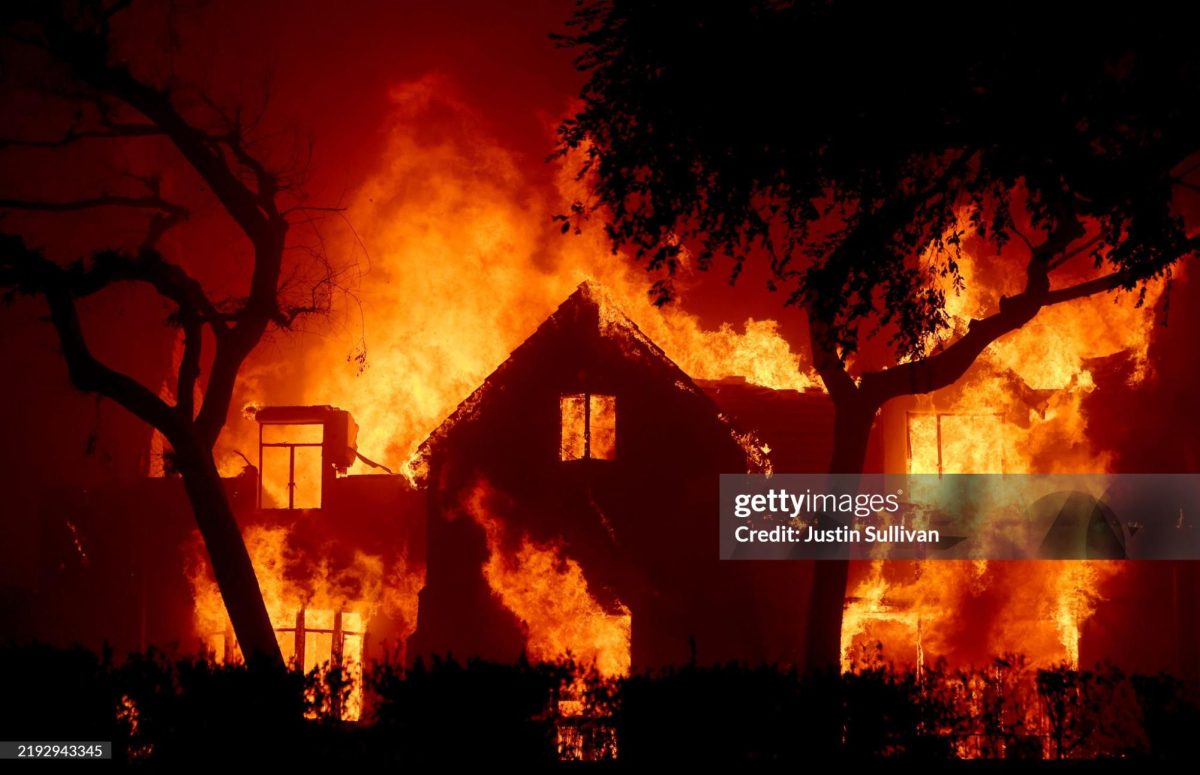 Fire engulfs a home as the Eaton Fire moves through the area on January 08, 2025 in Altadena, California. 