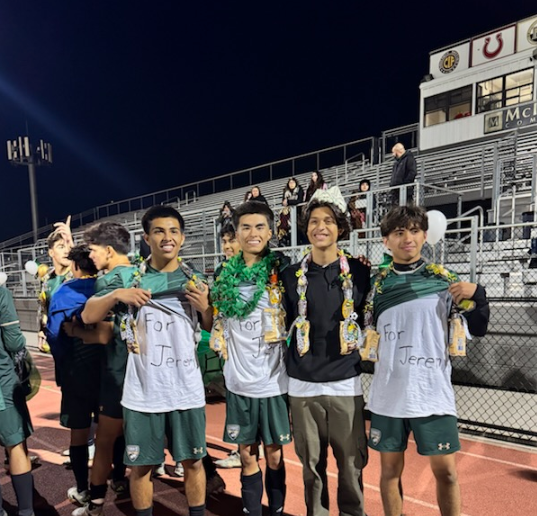 SHHS varsity soccer captains pose for a photo after their senior night game at District Field on January 31. 