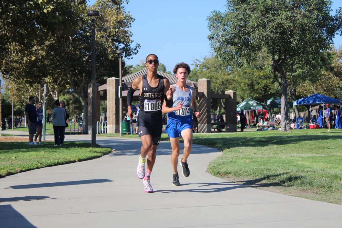 Jamal Mckissick (11) leads the pack as an Alta Loma competitor follows closely behind at the Sept. 11 league opener. 