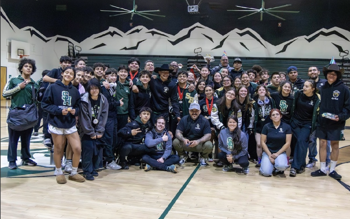 Boys and Girls Wrestling teams pose for a photo after League Finals.