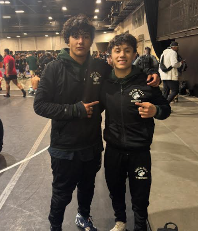 Rex Topete (11) and Kayden Vasquez (12) pose for a photo on Feb. 26 prior to state finals. 
