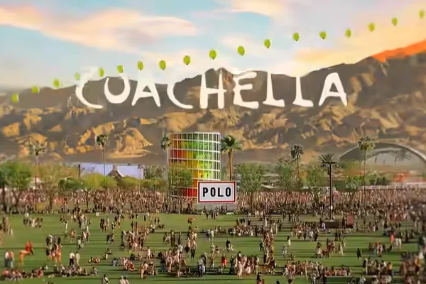 The crowd walks through the festival grounds in a promotional image for Coachella 2026.